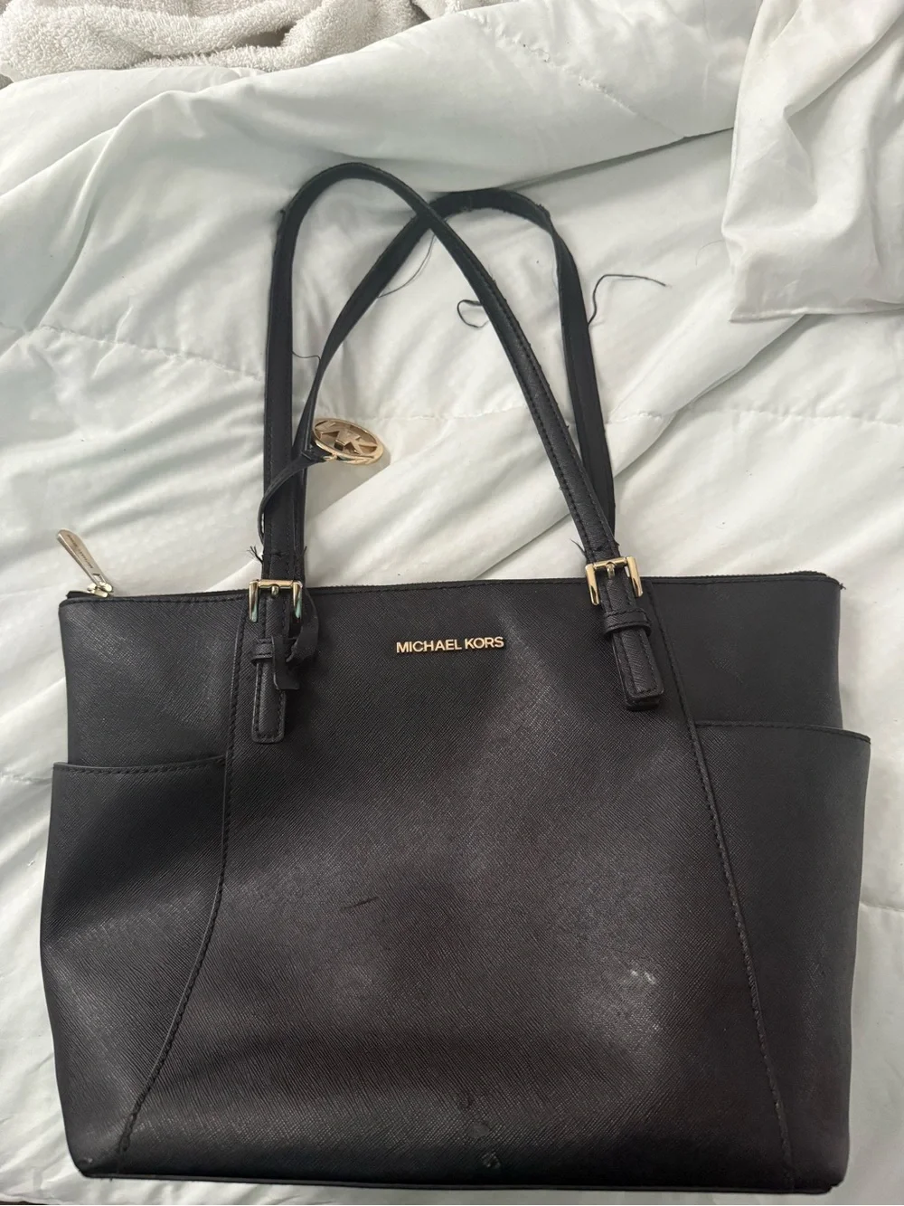 MICHAEL KORS Black Saffiano Tote with Gold Hardware. The straps are messed up